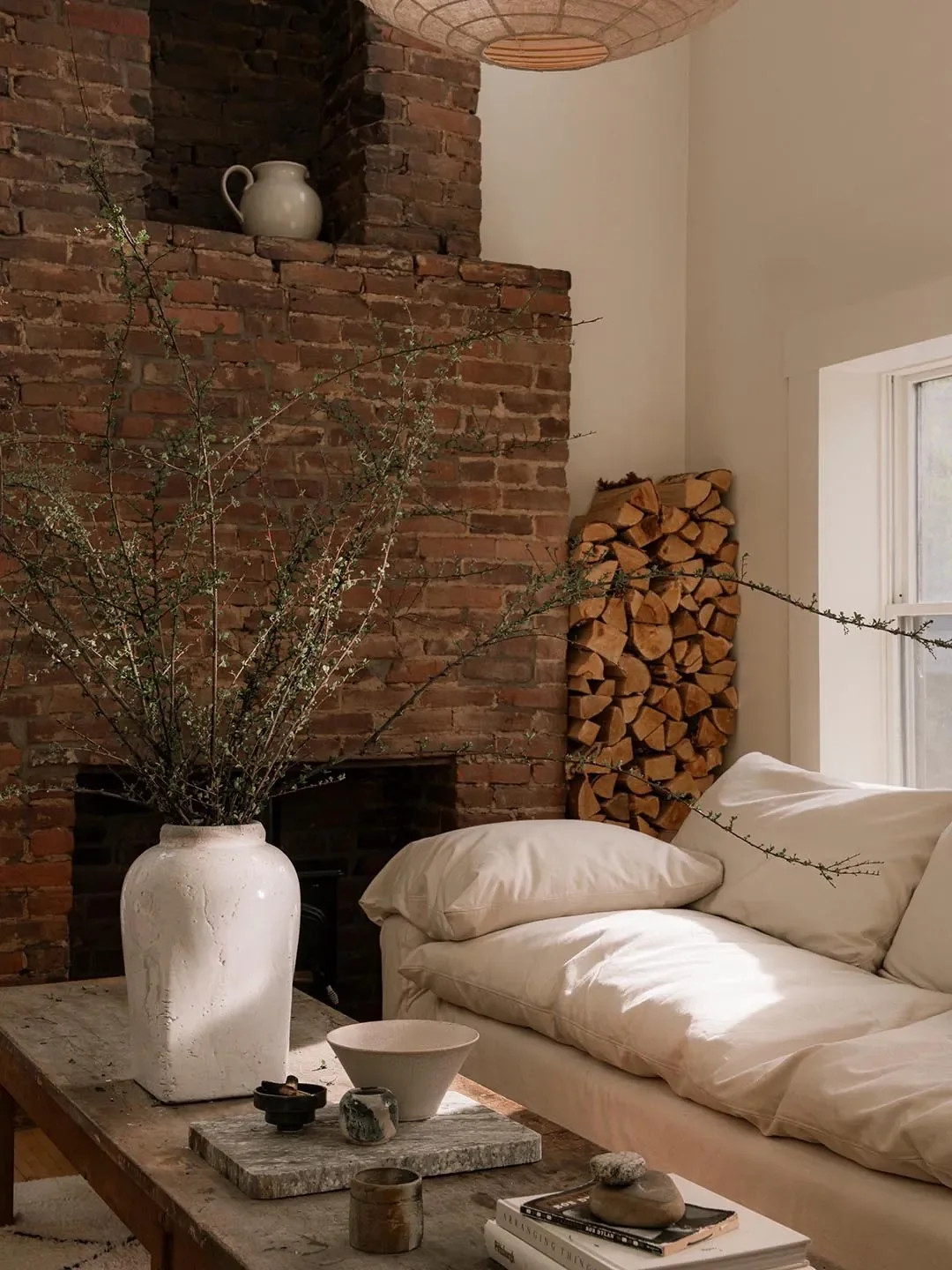Tiered Palo Santo Holders,Oatmeal Shop; Scented Candle,Buck Mason; Ever Sofa,Leanne Ford for Crate & Barrel.