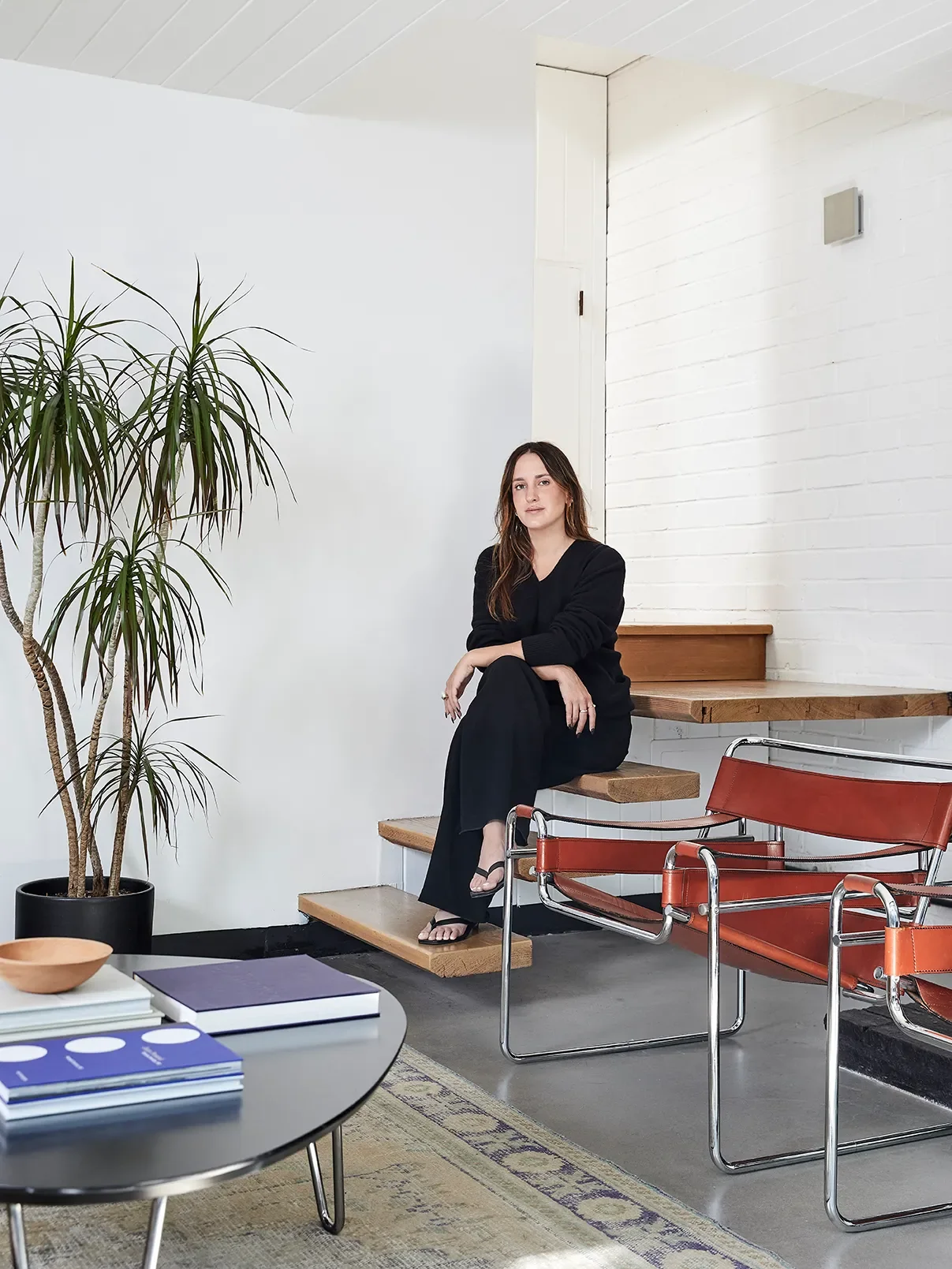 Erin Starkweather sitting on open stairs