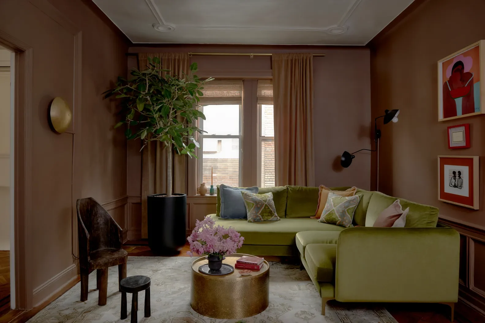 It was important for me to feel a sense of grounding in the living room. When I saw how much space I had to play with, I leaned all the way into a moody feel with Fox Hollow Brown by Benjamin Moore, w